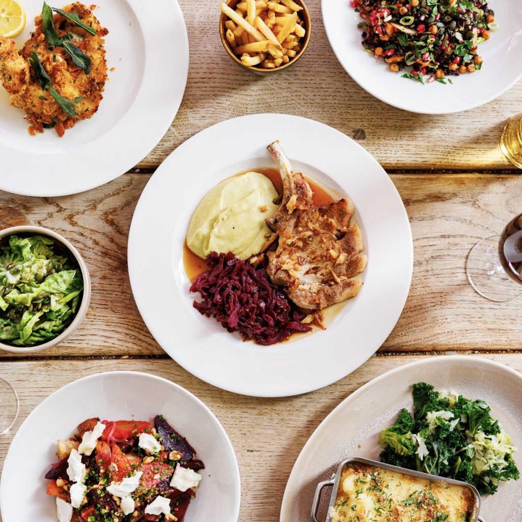 A mix of hearty seasonal pub dishes, including Jimmy Butler's Pork Cutlet.